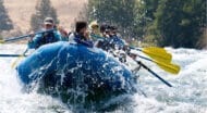 A group of people rafting down a river.