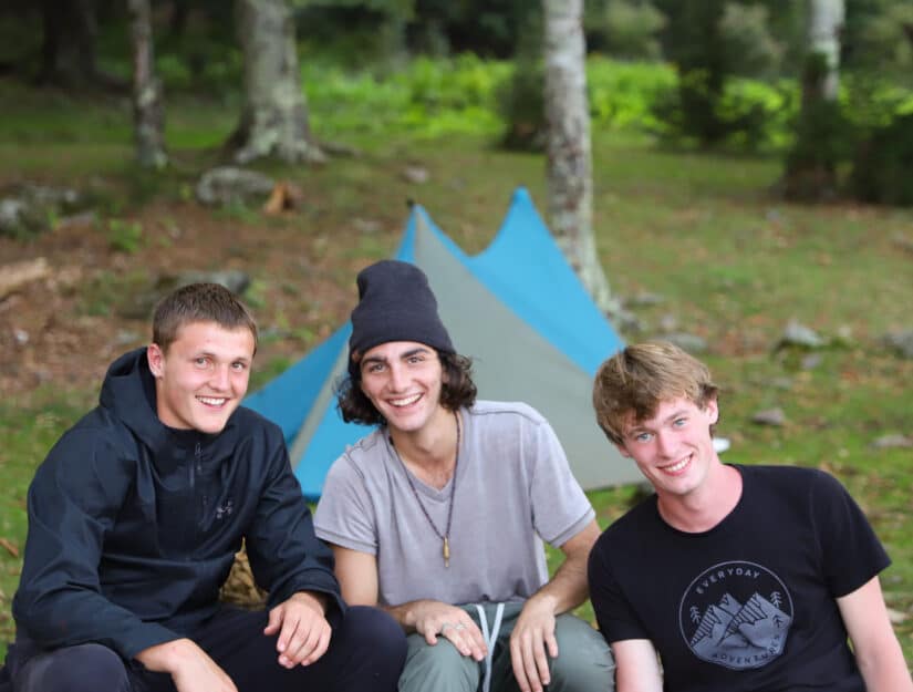 Three teenagers at camp.