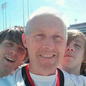 Team member Garry Pomerleau with two teenagers.