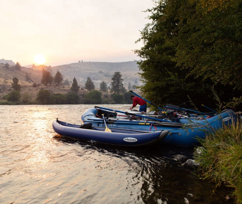 A person organizing rafts.