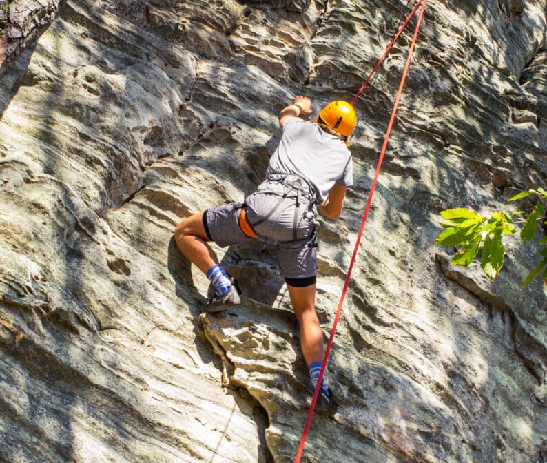 A person rock climbing.