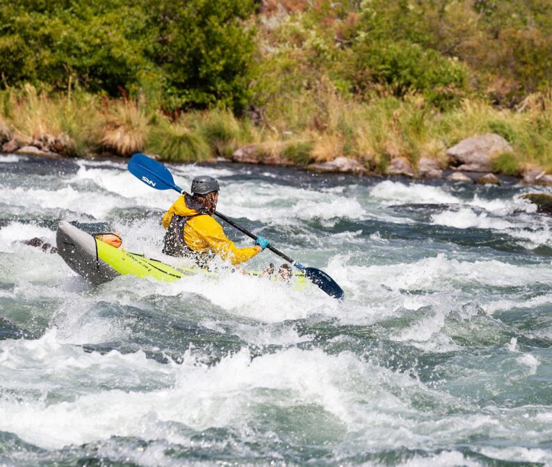 A person whitewater rafting.