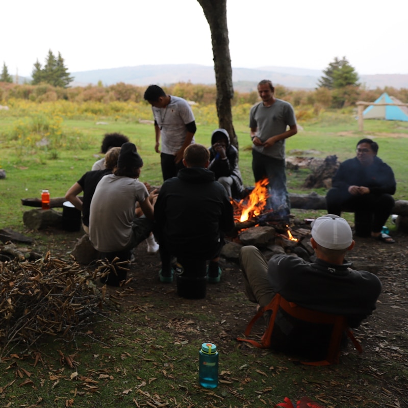 People gathered around a campfire.