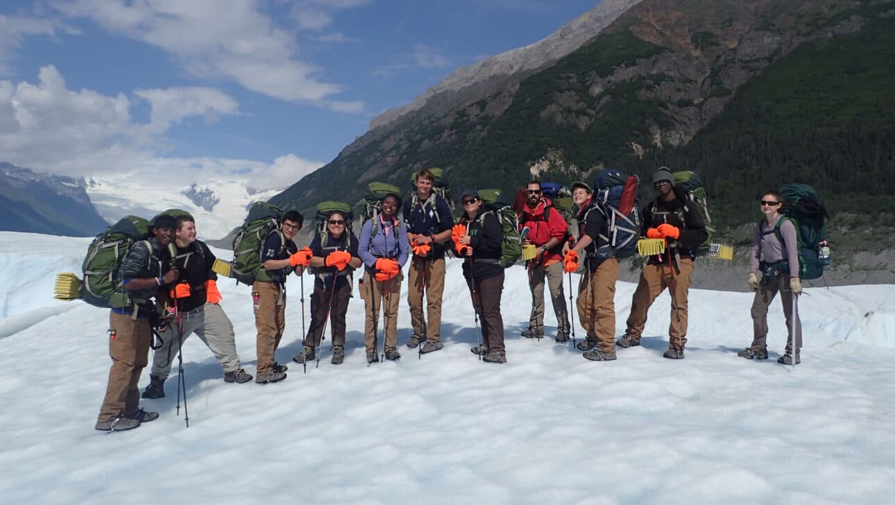 A group of people wearing backpacking gear.