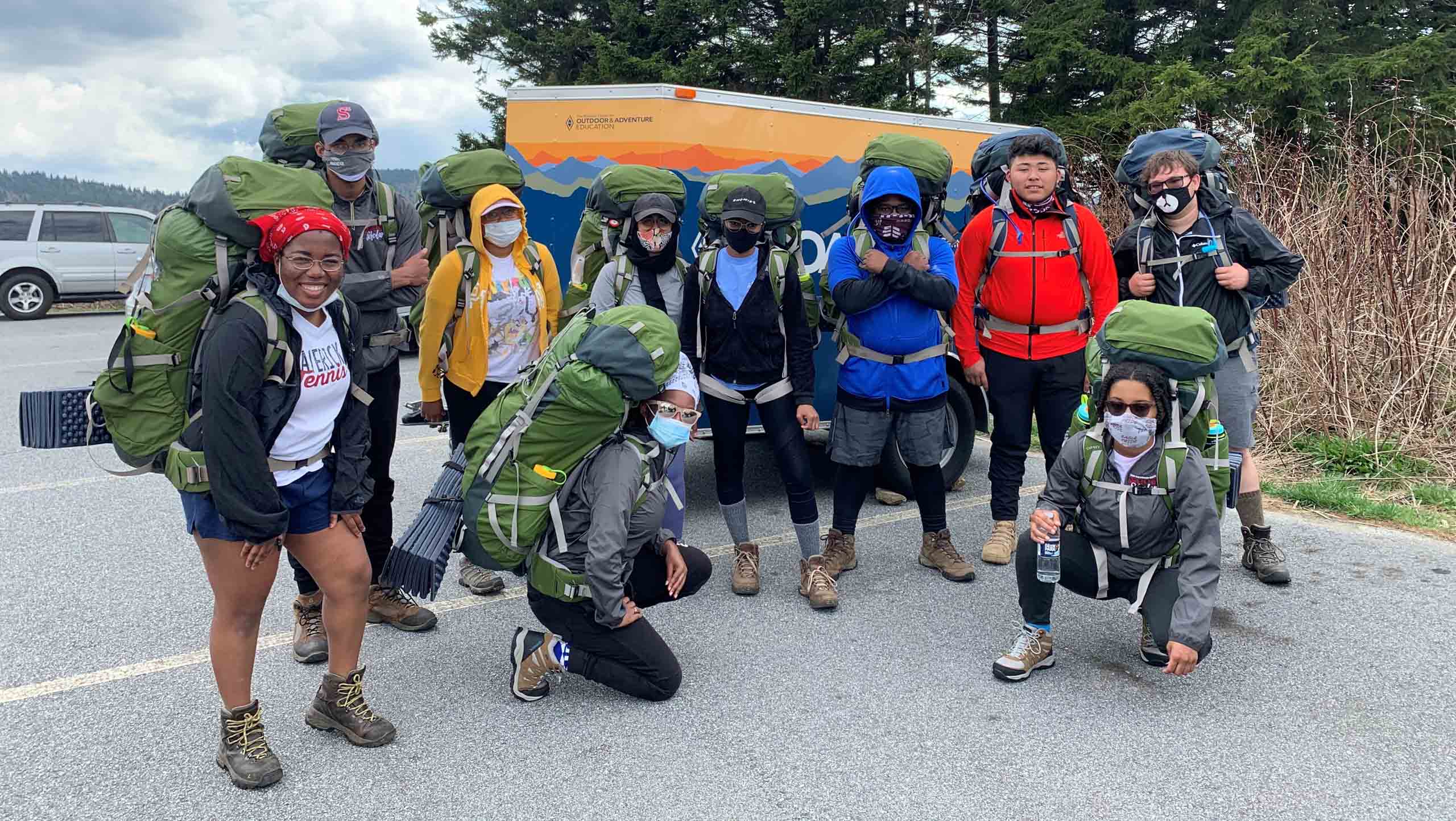 A group of college students with expedition gear.
