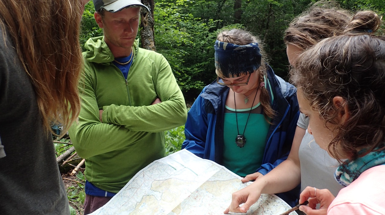 A group of people examining a map together.