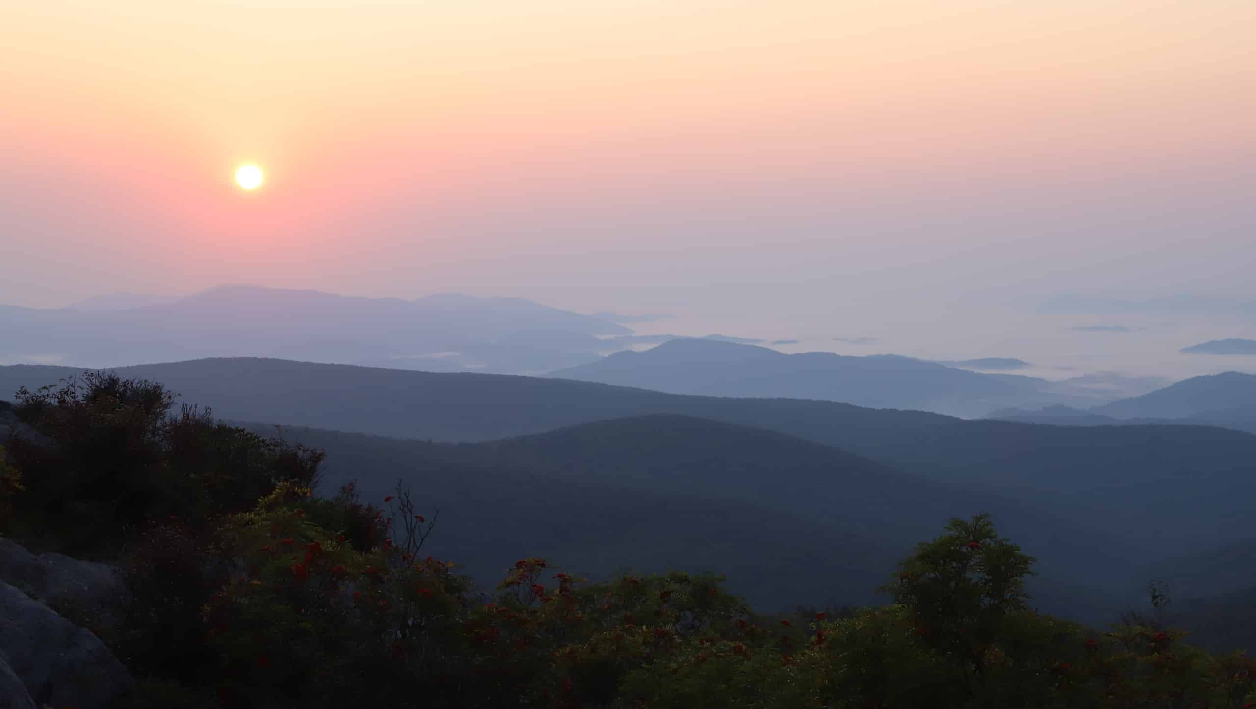 A sunrise above mountains.