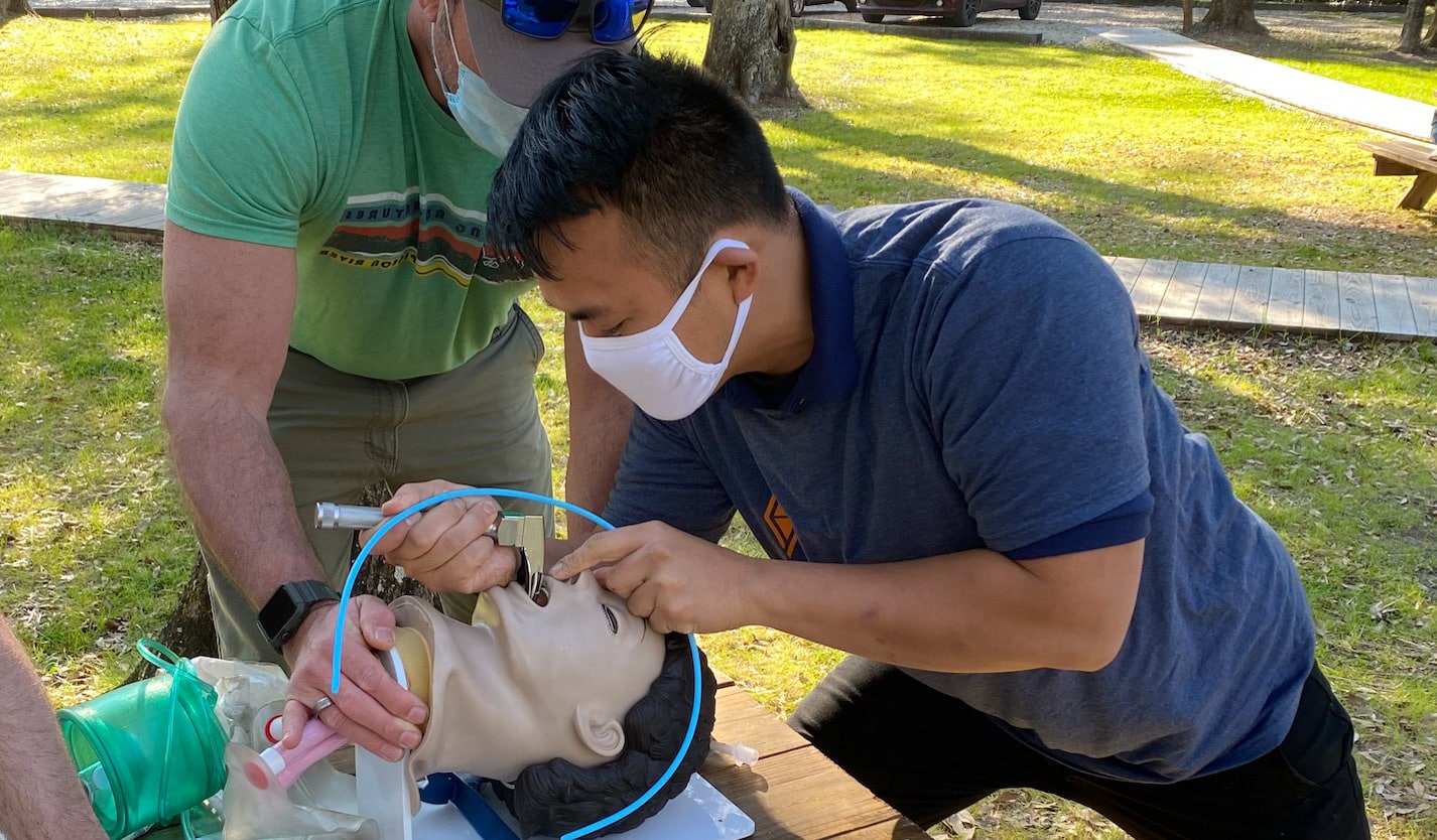 An EMT training student learning intubation.