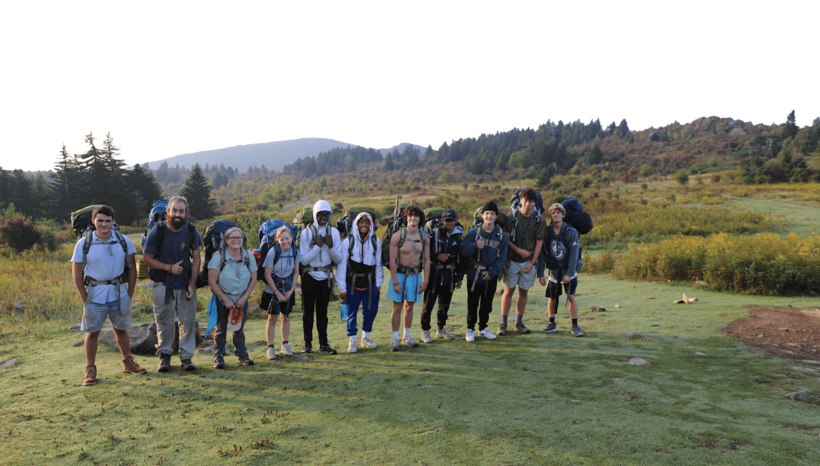 A group of teenagers ready for backpacking.
