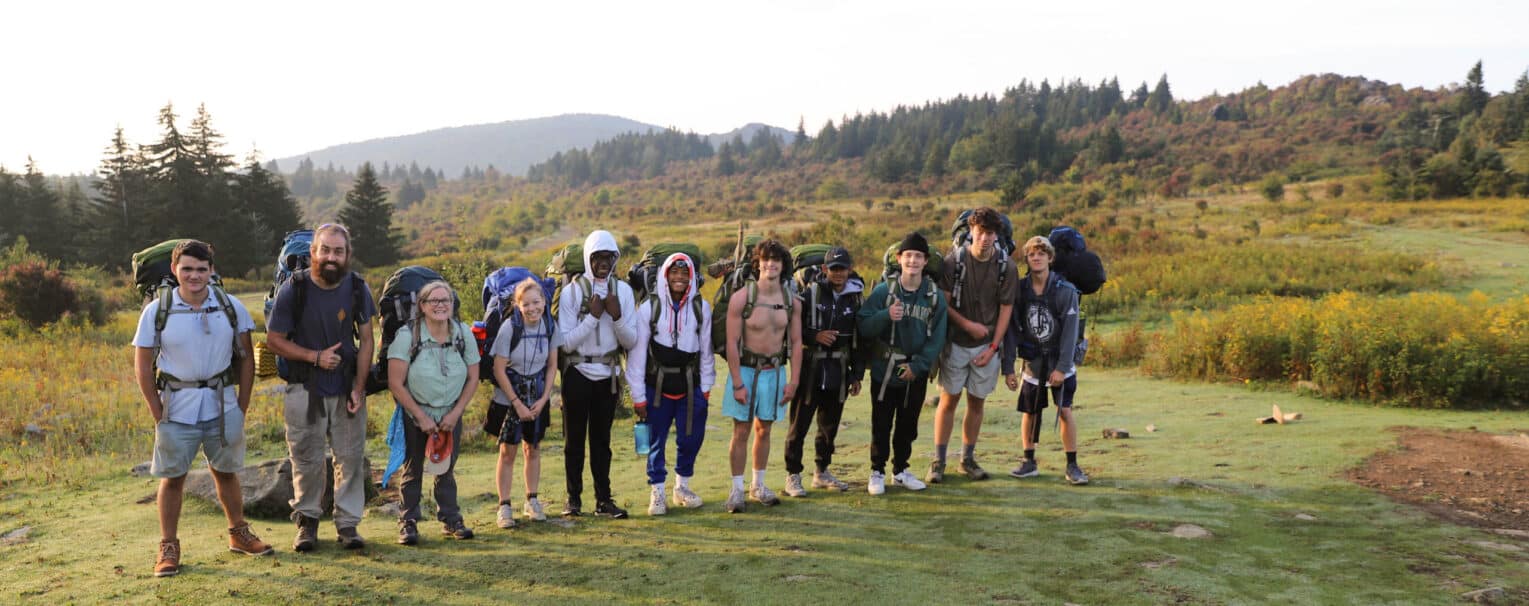 A group of teenagers on a backpacking expedition.