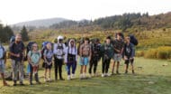 A group of teenagers on a backpacking expedition.