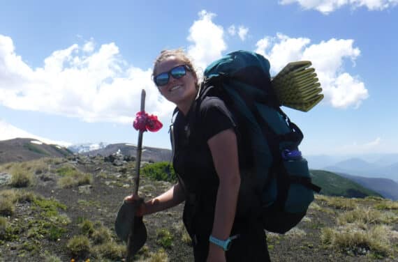 A woman backpacking.