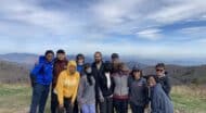 NCOAE students standing on mountain top together