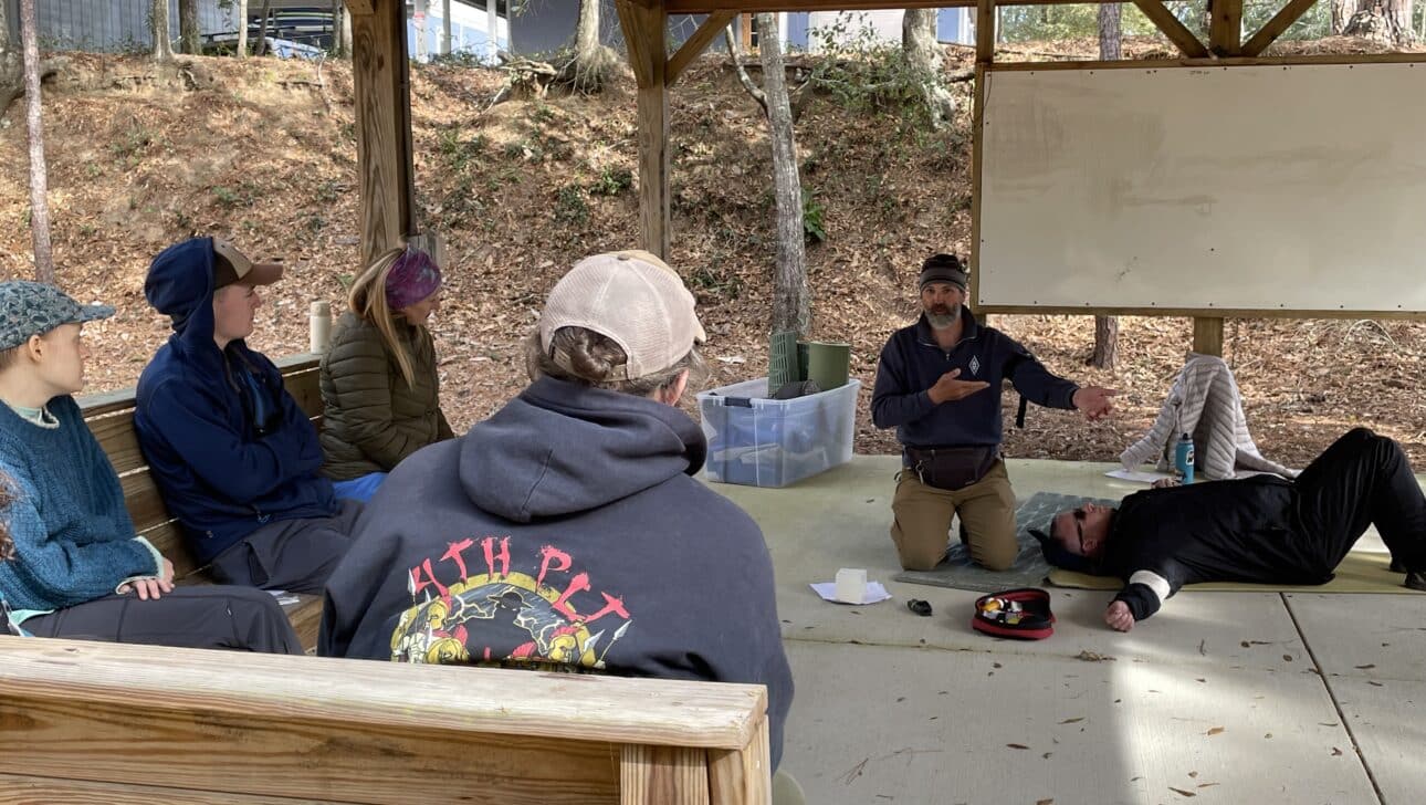 NCOAE students during EMT training, looking at instructor