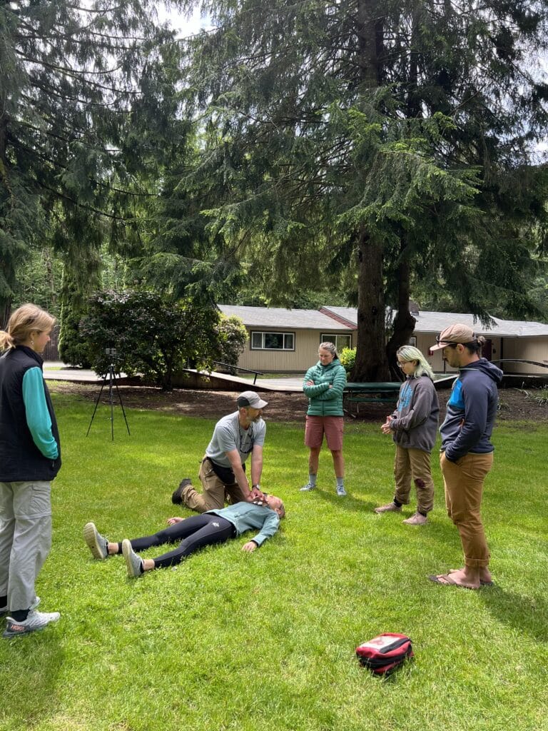 NCOAE students listening to instructor during Wilderness CPR training