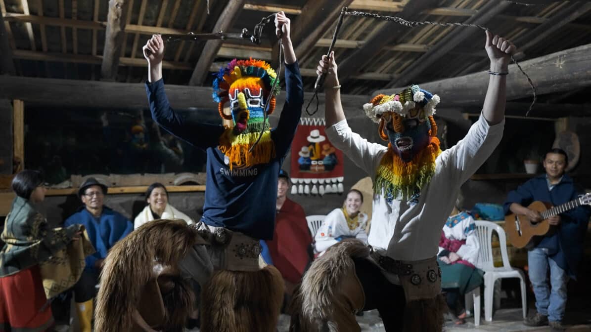 boys dancing in headgear.