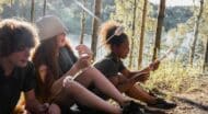kdis roasting marshmallows in the woods.